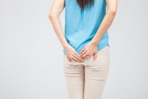 Woman has Diarrhea Holding her Butt: Isolated on White Background
